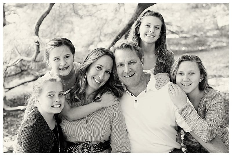 An Engaged Couple and their four girls at the Arboretum in Champaign, IL Photos by Ebby L Photography