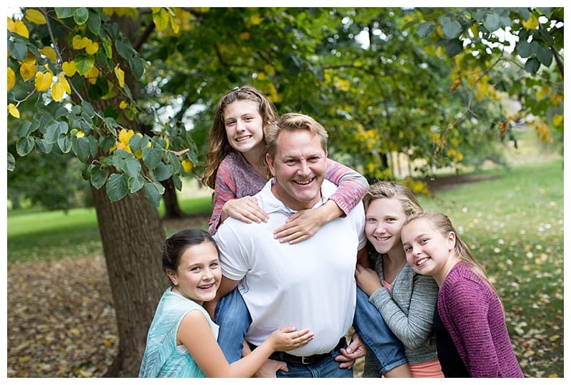An Engaged Couple and their four girls at the Arboretum in Champaign, IL Photos by Ebby L Photography