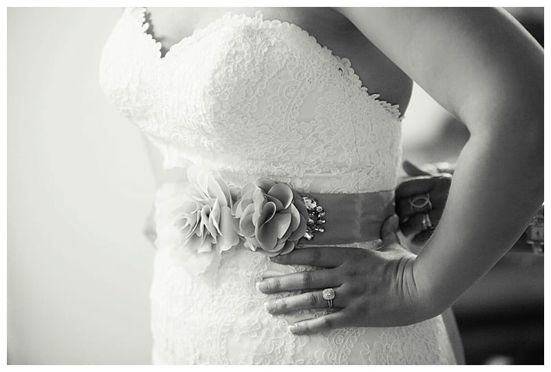 Bride puts on dress