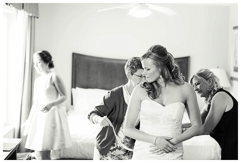 bride putting on dress
