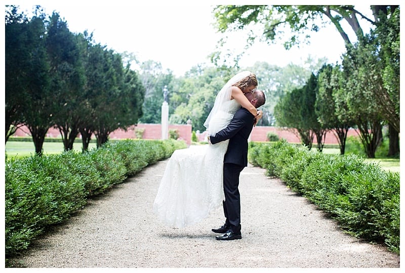 groom picking up bride