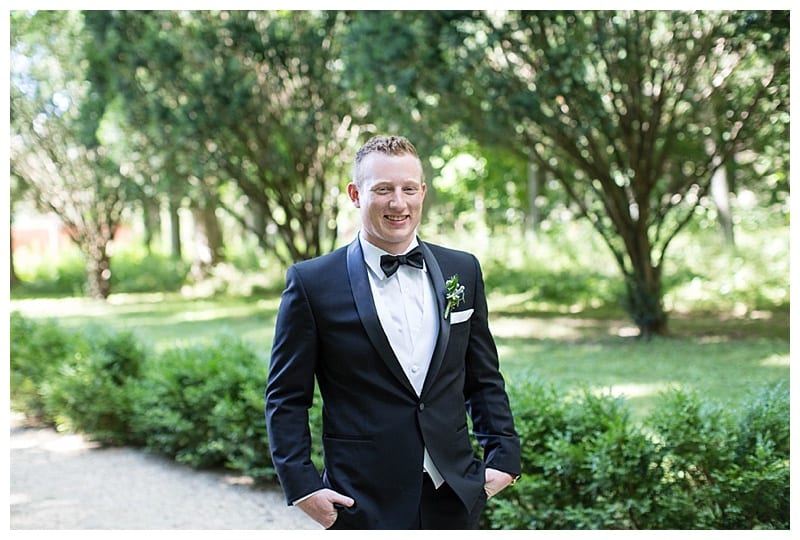 groom in black tux