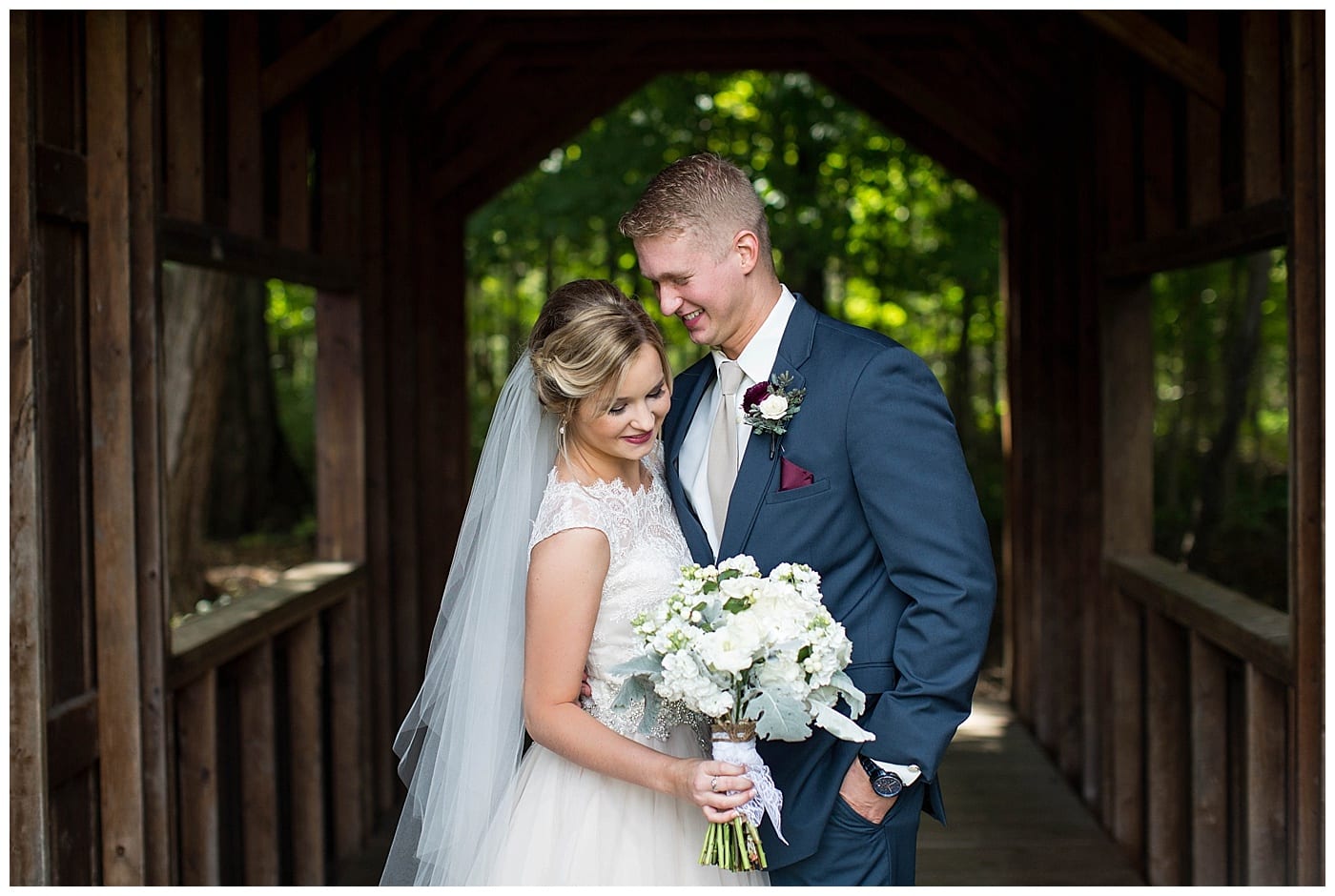 navy and maroon groom